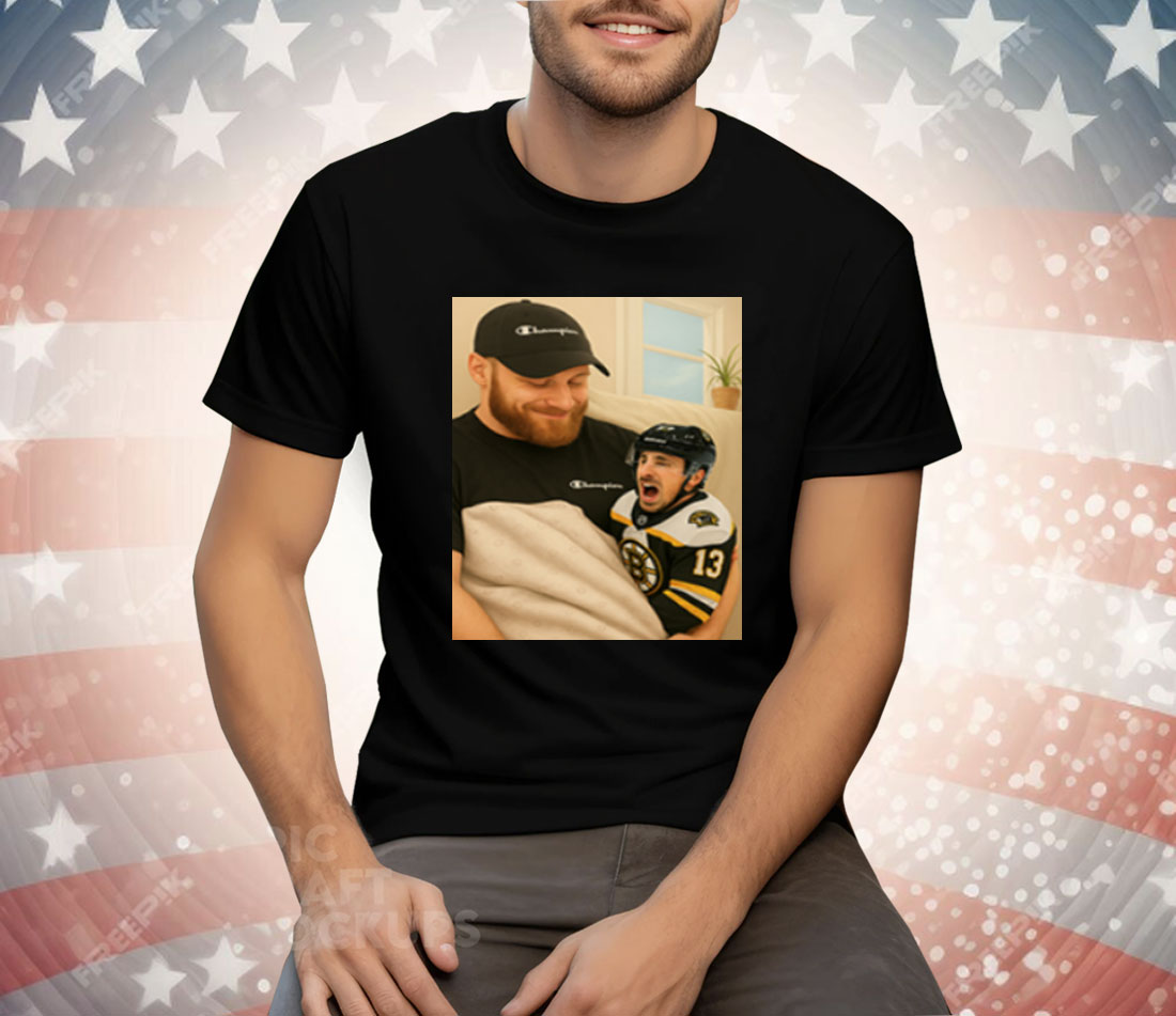 Sam Bennett Holding A Crying Marchand Tee Shirt